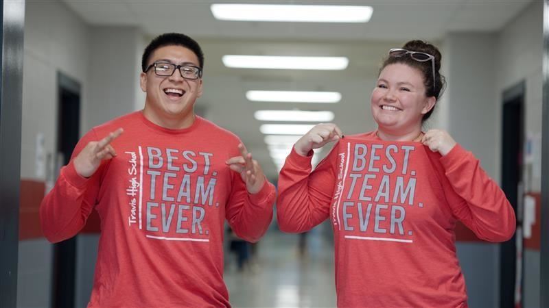 Two Teachers smiling wearing shirts that say "Best. Team. Ever."